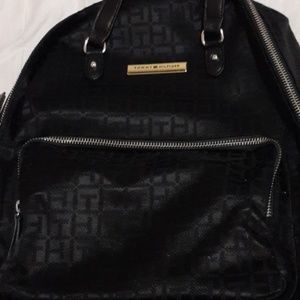 A black mini back pack. Tommy Hilfiger